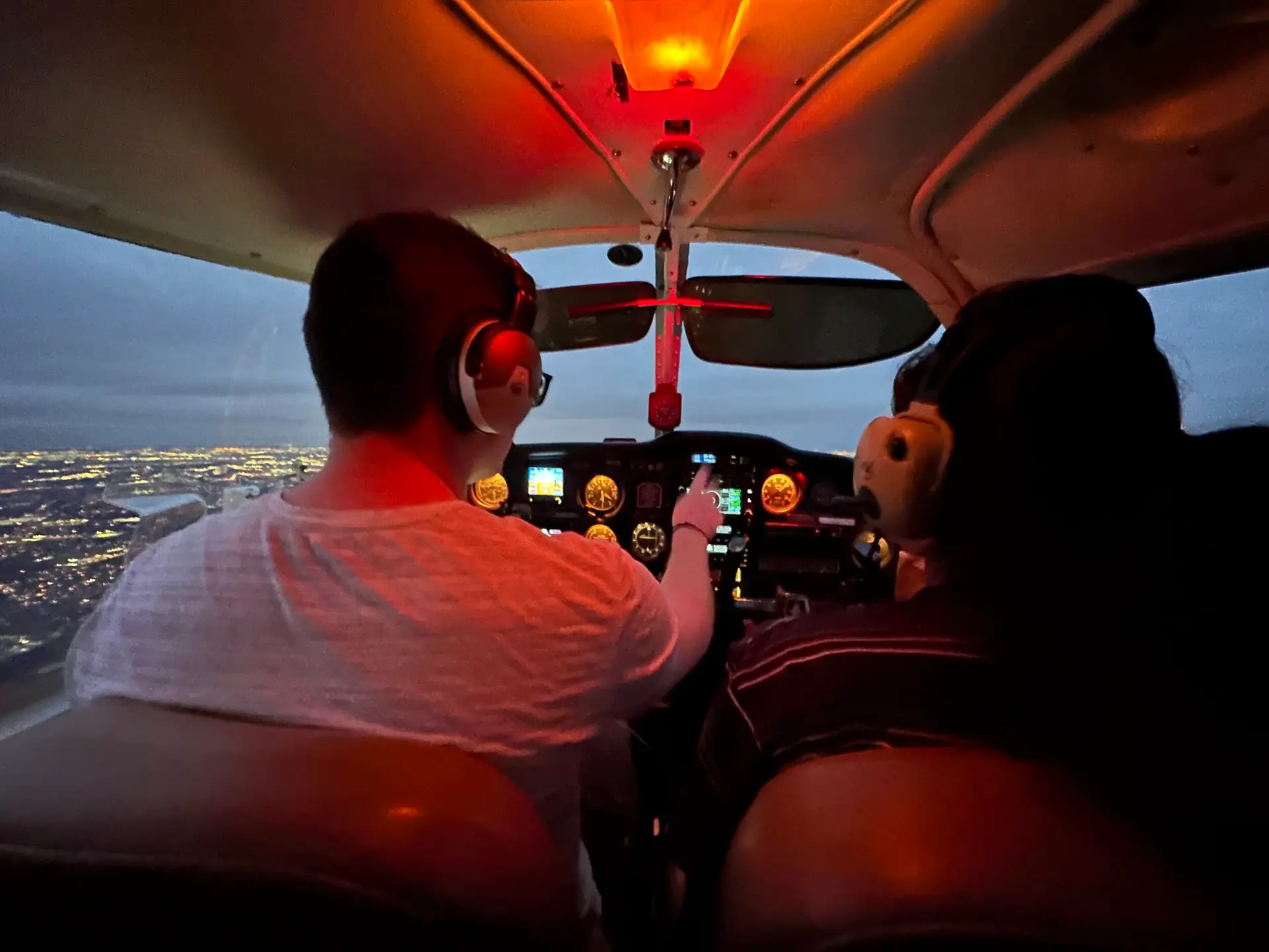 Flight instruction beside a small aircraft